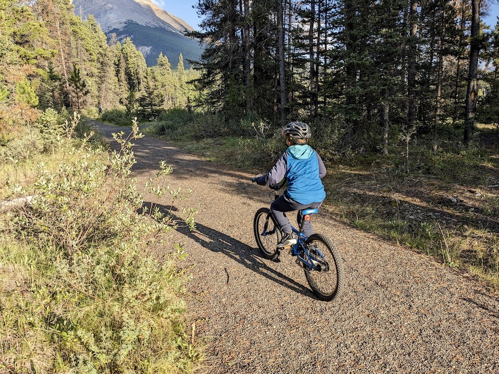 child biking gravel trail Banff National Park camping