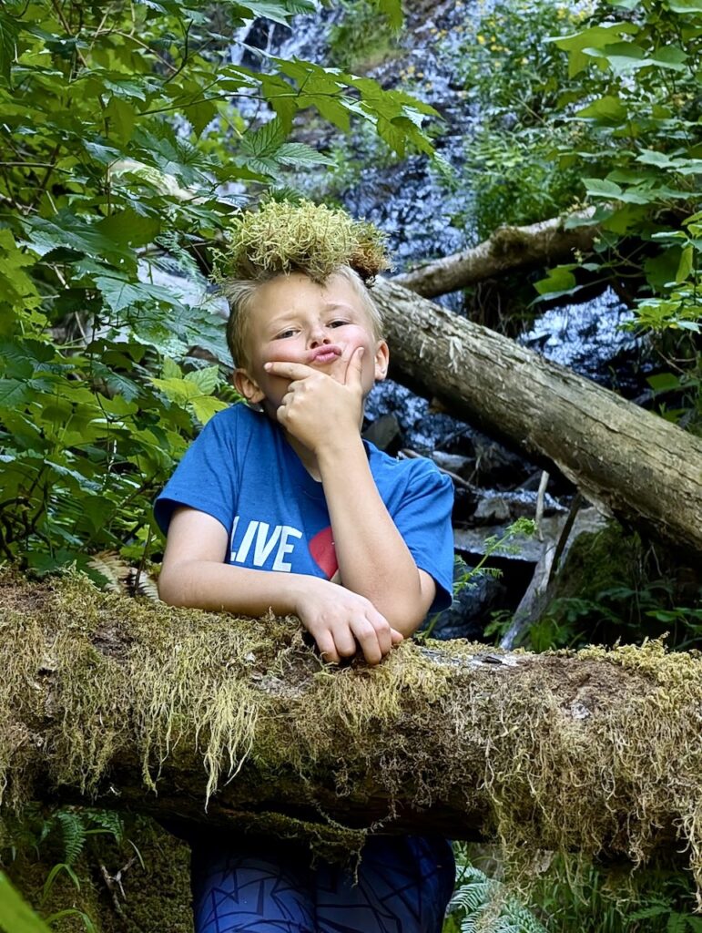 kid playing at Wilson Falls Oregon hiking Tillamook State Forest.